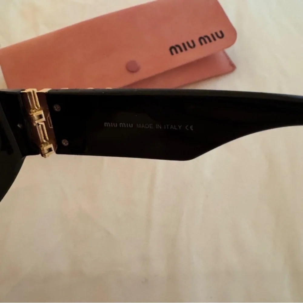 Miu Miu Glossy Black Cat-Eye Sunglasses with Pink Case